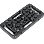 A black anodized aluminum camera mounting plate with multiple threaded holes and two long slot cuts, shown on a plain white background.