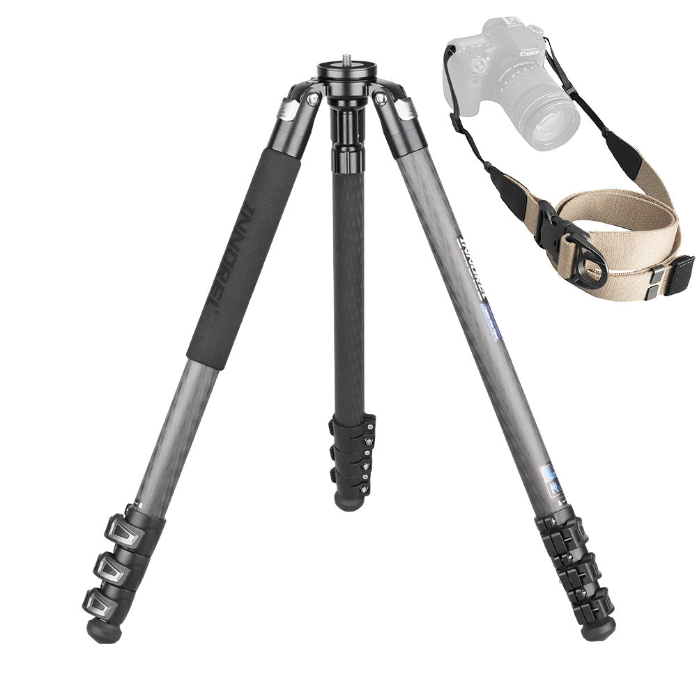A carbon fiber tripod with black rubberized leg grips and a beige webbing camera strap, shown on a white background with a faded overlay of a DSLR camera and strap.